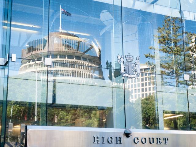 High court sign with beehive reflection 1